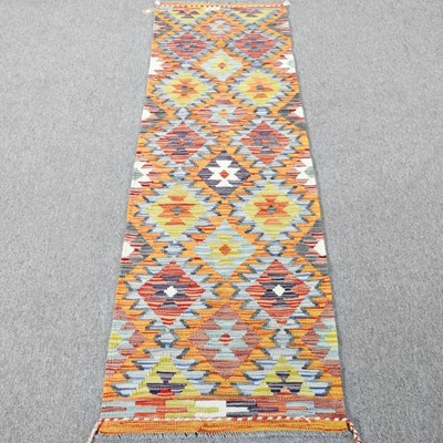 Lot 141 - A Persian kilim runner, with coloured diamonds,...