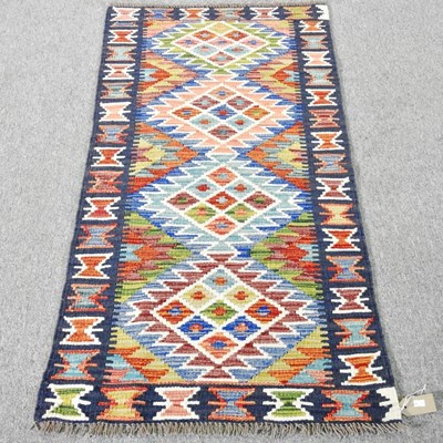 Lot 488 - A Persian kilim runner, with coloured diamonds,...