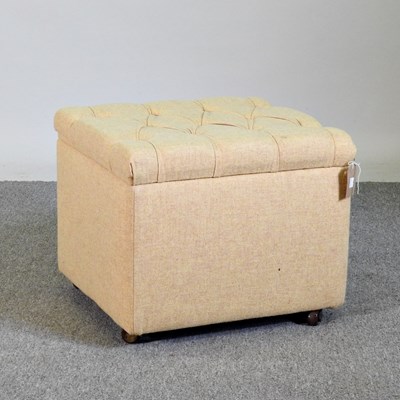 Lot 524 - A cream upholstered ottoman, with a buttoned top