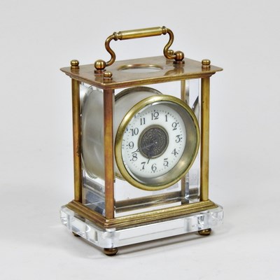 Lot 83 - A brass and glass cased carriage clock, 14cm high