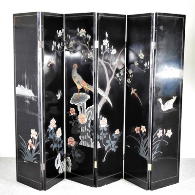 Lot 489 - A Chinese lacquered six fold dressing screen,...