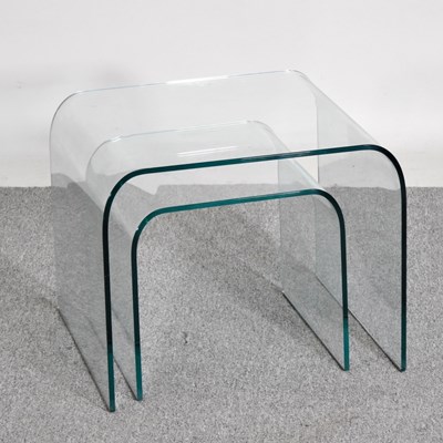 Lot 97 - A nest of two Italian glass occasional tables,...