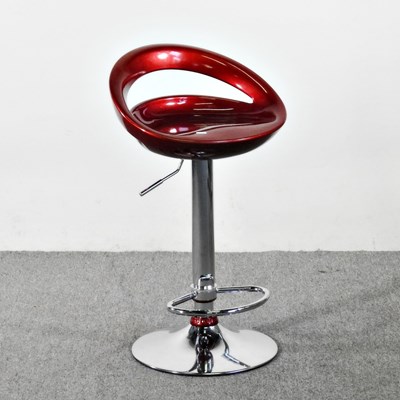 Lot 190 - A chrome bar stool, with a red moulded seat