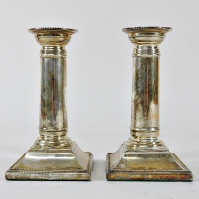 Lot 95 - A pair of modern silver table candlesticks,...