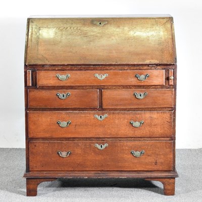 Lot 64 - A George III mahogany bureau, on bracket feet