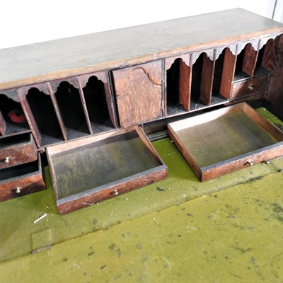 Lot 64 - A George III mahogany bureau, on bracket feet