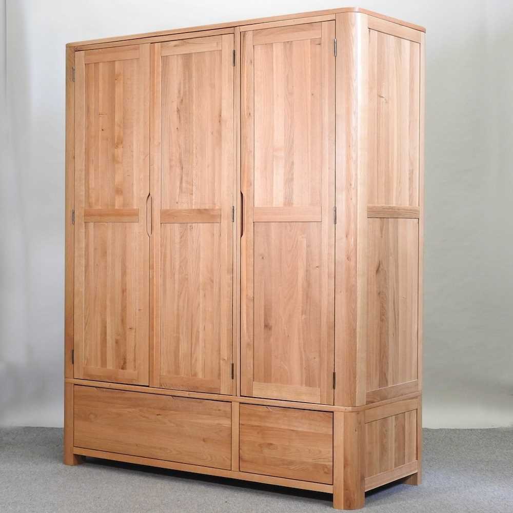 Lot 490 - A modern light oak wardrobe