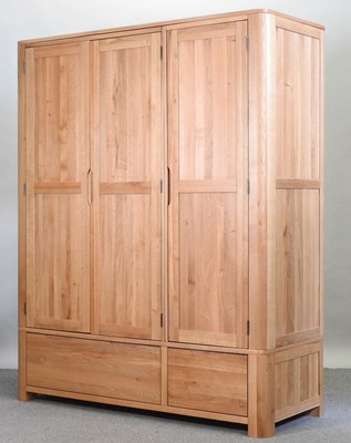 Lot 490 - A modern light oak wardrobe