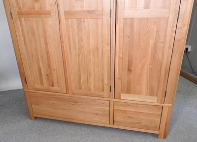 Lot 490 - A modern light oak wardrobe