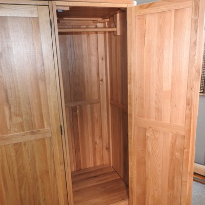 Lot 490 - A modern light oak wardrobe