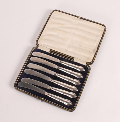 Lot 100 - A set of six silver handles butter knives,...