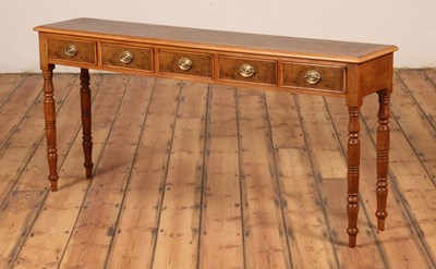 Lot 323 - A walnut hall table, the frieze containing...