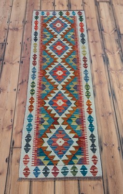 Lot 408 - An Afghan Chobi kilim runner, 190 x 60cm