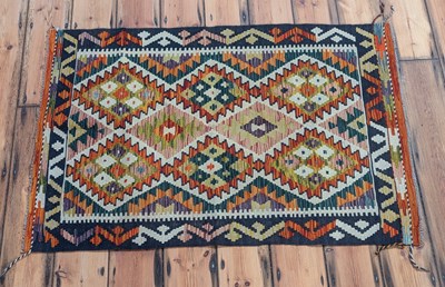 Lot 245 - An Afghan Chobi kilim rug, with polychrome...