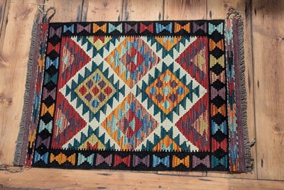 Lot 528 - An Afghan Chobi kilim rug, with colourful...