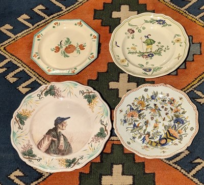 Lot 125 - A collection of four French faience plates,...