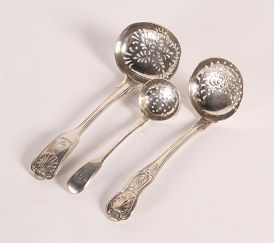 Lot 144 - Three regimental silver sifting spoons, to...