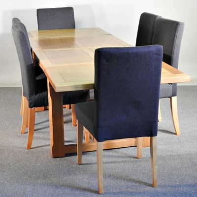 Lot 380 - A modern light oak extending dining table,...