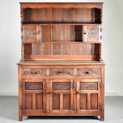 Lot 450 - A mid 20th century oak dresser, with a boarded...