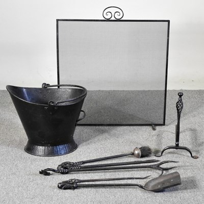 Lot 484 - A collection of hand forged fire tools,...