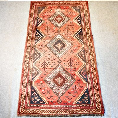 Lot 151 - A Persian woollen carpet, with three central...