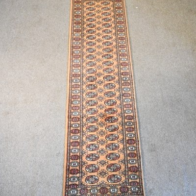 Lot 43 - A Bokhara runner, 310 x 78 cm with rows of...