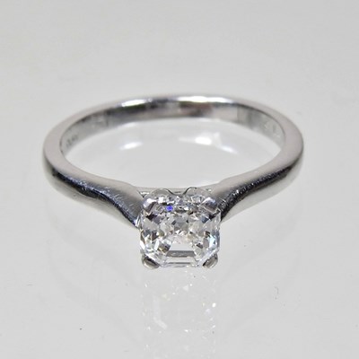 Lot 24 - A platinum square emerald cut diamond...