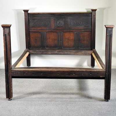 Lot 153 - A 19th century oak bedstead, with a panelled...