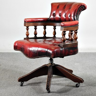 Lot 11 - A red leather button back desk chair