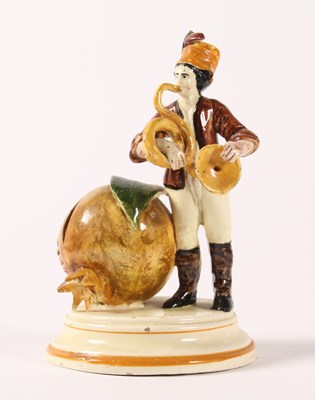 Lot 504 - An unusual earthenware moneybox, 19th century,...