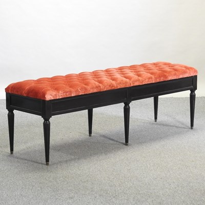Lot 504 - A French style orange button upholstered window seat