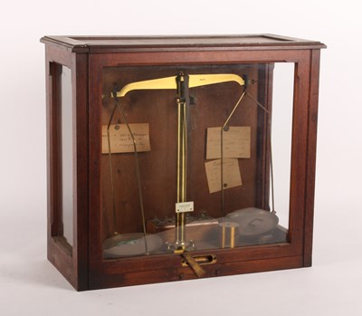 Lot 249 - A mahogany cased set of weighing scales, 20th...