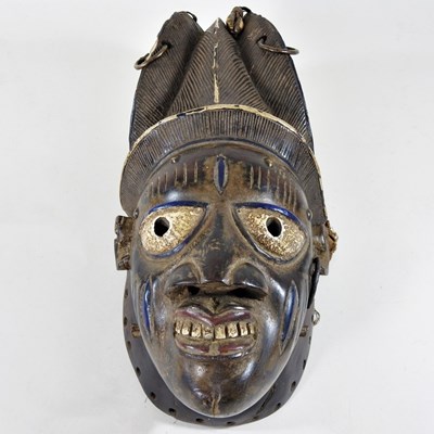 Lot 176 - An African carved wooden and painted tribal...