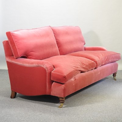 Lot 706 - A good quality modern Howard style red velvet upholstered three seat sofa