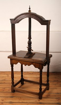 Lot 350 - An antique oak book press, having an arched...