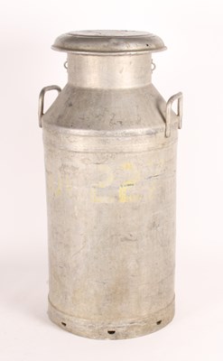 Lot 82 - A large metal milk churn, inscribed...