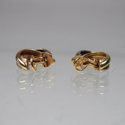 Lot 449 - A pair of Cartier 18 carat Trinity three...