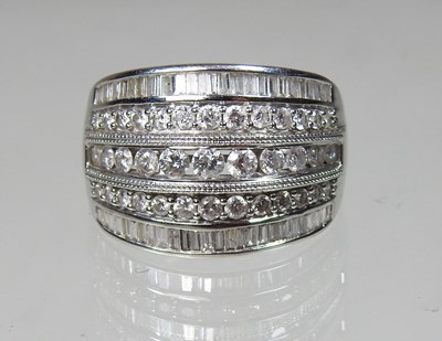 Lot 337 - An 18 carat gold diamond dress ring, composed...