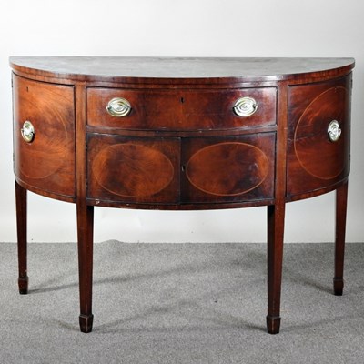 Lot 498 - An Edwardian mahogany bow front sideboard, on...