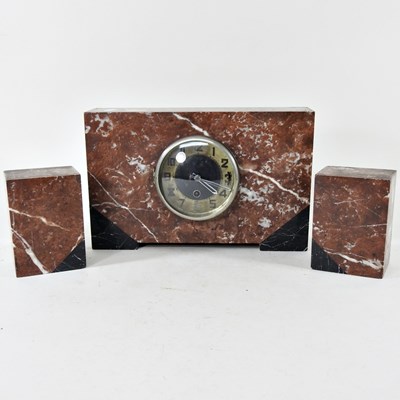 Lot 482 - An Art Deco marble three piece clock garniture