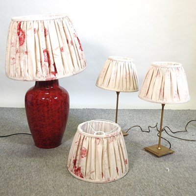 Lot 512 - A large red pottery table lamp and shade