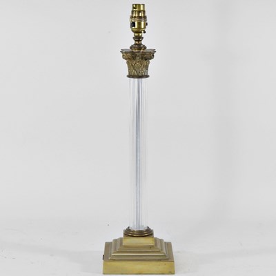 Lot 274 - A brass and glass table lamp base, in the form...