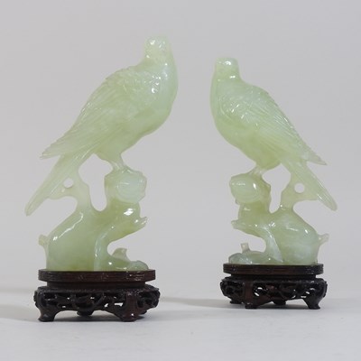 Lot 146 - A pair of oriental carved jade coloured stone birds