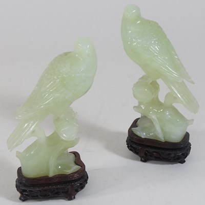 Lot 146 - A pair of oriental carved jade coloured stone birds