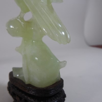 Lot 146 - A pair of oriental carved jade coloured stone birds