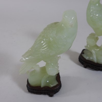 Lot 146 - A pair of oriental carved jade coloured stone birds