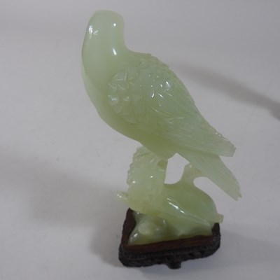 Lot 146 - A pair of oriental carved jade coloured stone birds