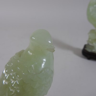 Lot 146 - A pair of oriental carved jade coloured stone birds