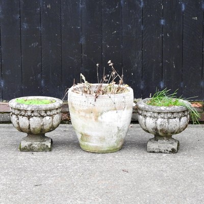 Lot 221 - A pair of cast stone garden pots, of pedestal...