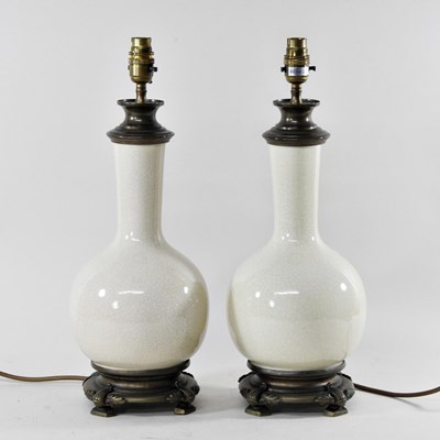 Lot 241 - A pair of crackle glazed pottery table lamps,...